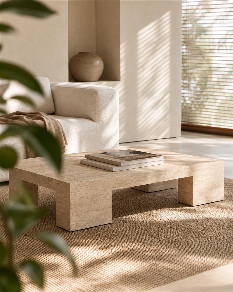 Beige travertine coffee table in a sunlit neutral living room