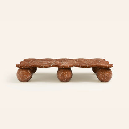 Sculptural rectangular marble coffee table with spherical stone legs