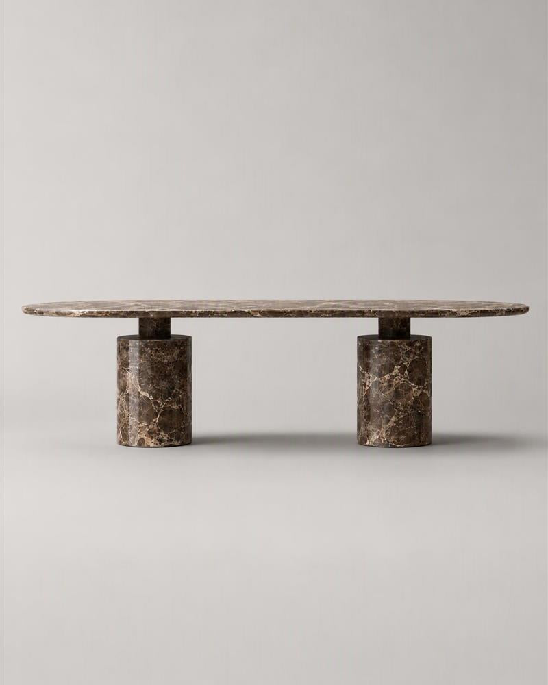 Front view of Emperador oval dining table and twin pedestal bases
