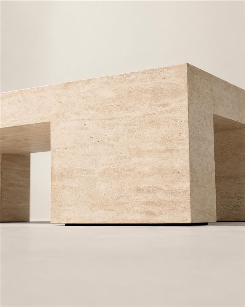 Geometric leg and corner detail of the Monolith travertine coffee table