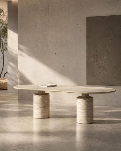 Beige travertine oval dining table in a calm gallery interior