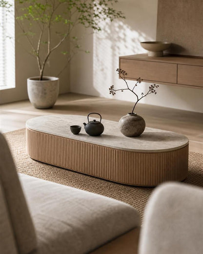 Taj Mahal stone coffee table styled with a teapot and ceramic vase