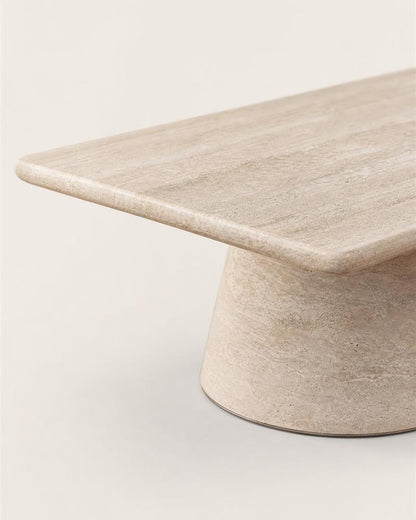 Rounded corner and stone edge detail of the travertine coffee table