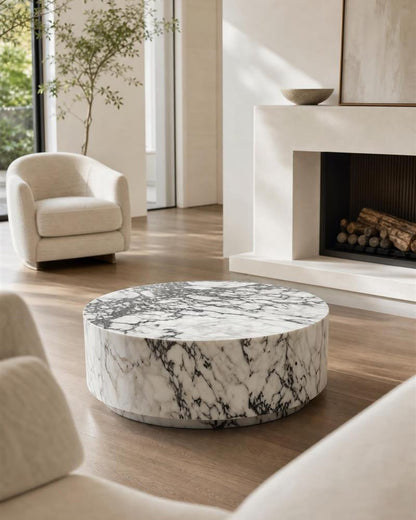 Round Calacatta Viola marble coffee table in a neutral living room