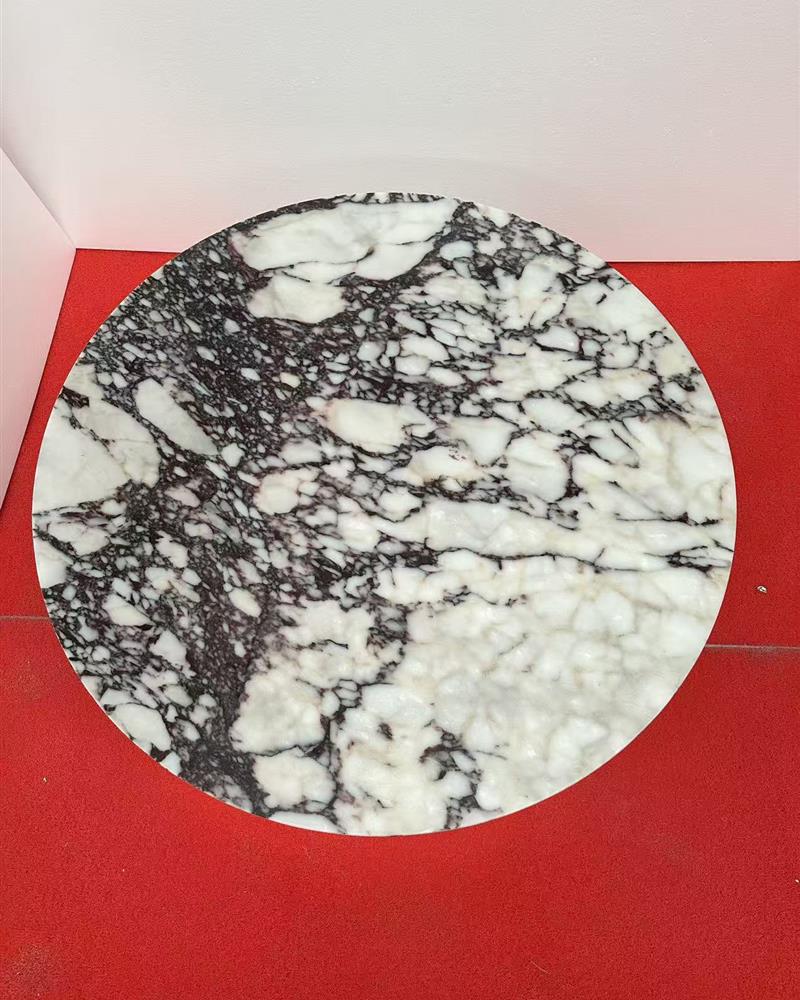 Top view of round Calacatta Viola marble coffee table